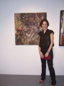 Carrie at an exhibition including her work at a gallery called Tashkeel. It is a self-portrait
